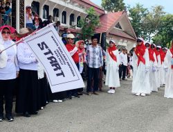 Unik, 2.530 Perempuan Majelis Ta’lim Gerak Jalan Indah dengan Busana Muslim